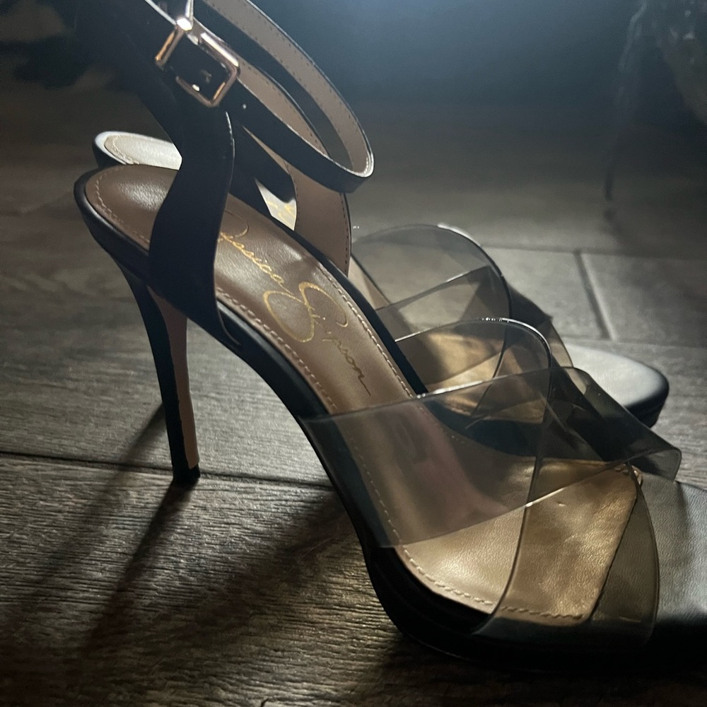 Black leather pump with thick clear black straps and black leather ankle strap